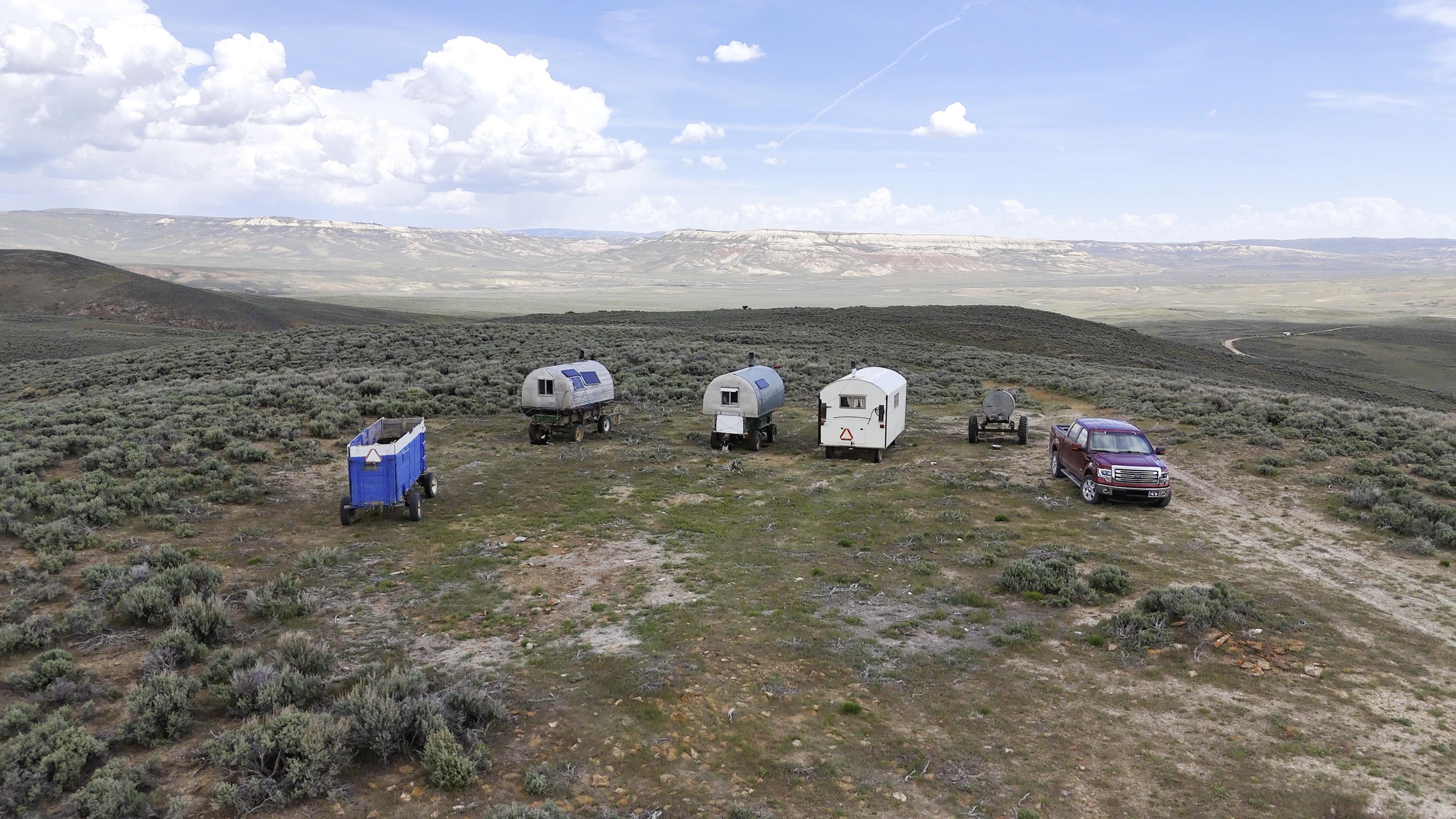Sheep campers arranged across the open range near Kemmerer, Wyoming